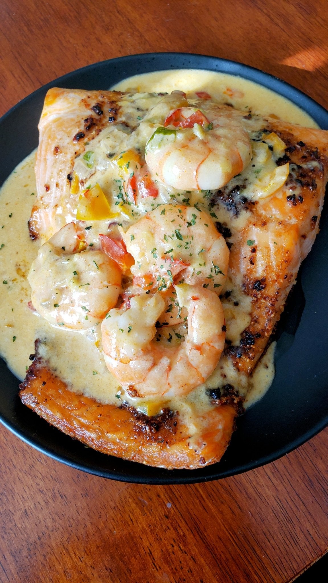 salmon with a shrimp cream sauce